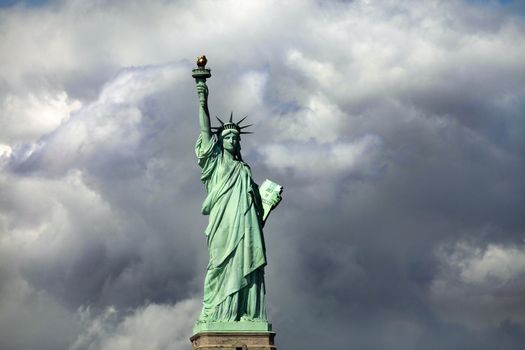 Statue of Liberty on Liberty Island in New York City. - isolated on blue sky background