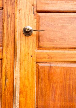 Wooden door with a knob.