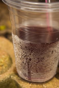 Glass of sparkling fresh drink water with bubbles rising
