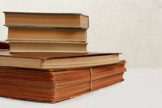 collection of old worn books on white