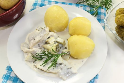 Cream herring with boiled potatoes and cucumber