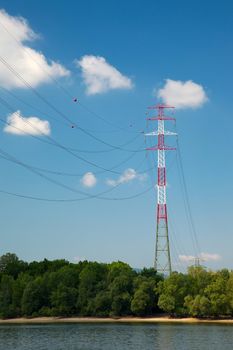 Tall electricity tower at a river crossing