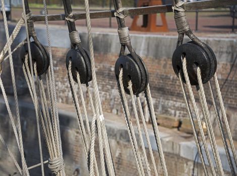 wooden pulley with rope on a ship