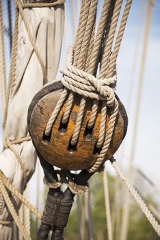 wooden pulley with rope on a ship