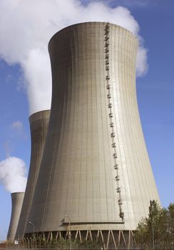 photo of a nuclear power plant chimneys active