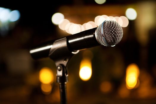 Music background with microphone and Concert lights