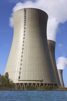 photo of a nuclear power plant chimneys active