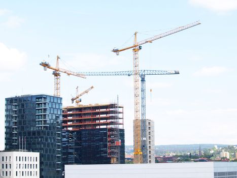 Construction site overview in a city, towards blue sky