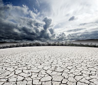 surreal cloudy dream-scape and cracked ground 
