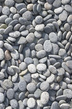 blue grey pebbles rounded from coastal erosion