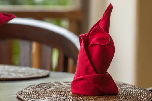 Folded napkins outdoors on a table in the tropics