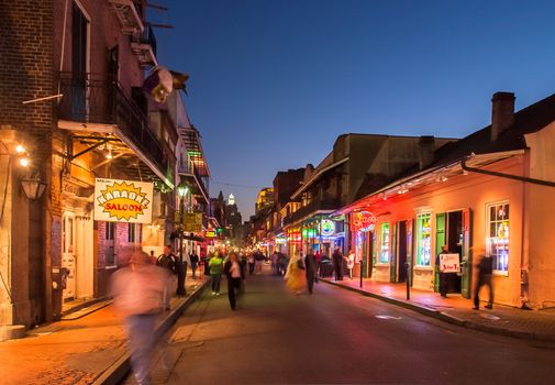 NEW ORLEANS, USA - CIRCA MARCH 2008: Crowds of people and neon lights at dusk circa March 2008 in New Orleans, USA. Tourism is the area's major source of income after Hurricane Katrina in 2005.