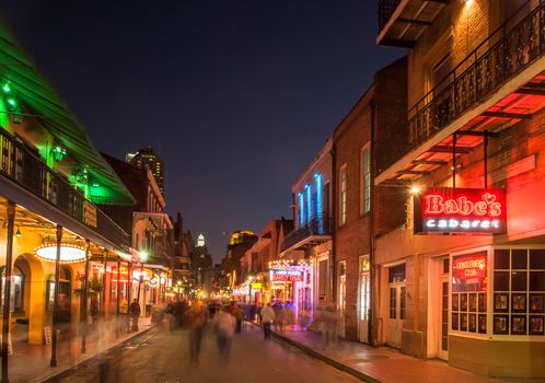 NEW ORLEANS, USA - CIRCA MARCH 2008: Crowds of people and neon lights at dusk circa March 2008 in New Orleans, USA. Tourism is the area's major source of income after Hurricane Katrina in 2005.