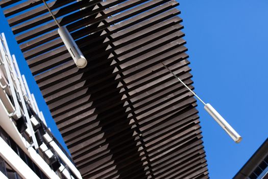 Modern lights and wood structure with blue sky