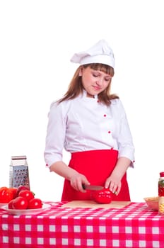 attractive woman cuts vegetables , cooking dinner