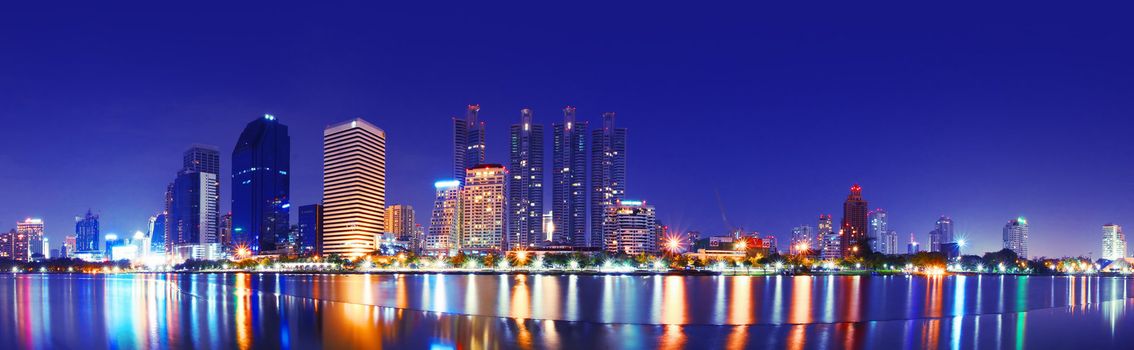 A beautiful city at night. Light reflected on the water body.