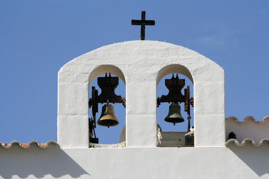 Two bells of a white church in Ibiza