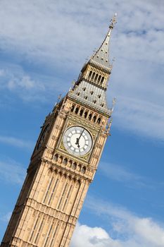 Britain national symbol Clock Big Ben (Elizabeth tower in Gothic Revival style) at 5 o’clock on cloudy sky background in London