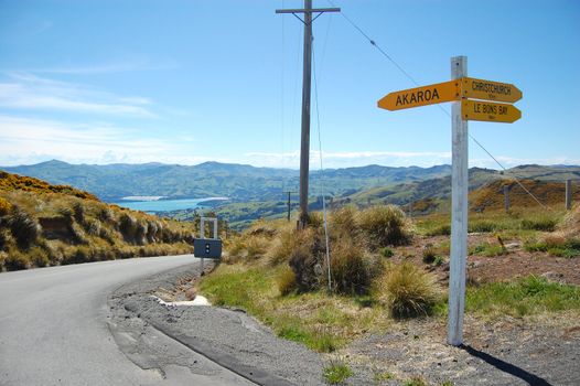 Directions sign at road junction, Banks Peninsula, near Akaroa, New Zealand