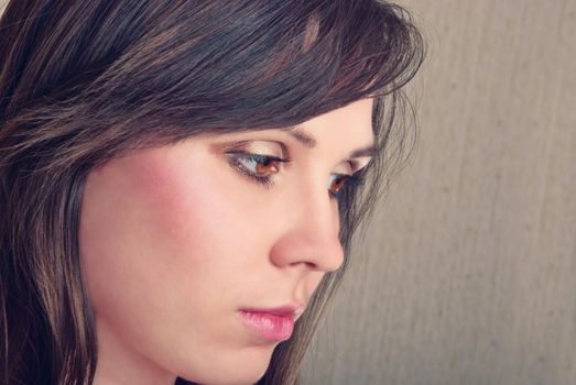 Closeup portrait of beautiful brunette. Studio shot