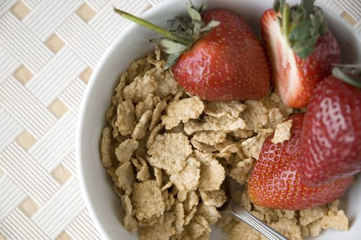 cereal bowl with strawberry with white background on top view