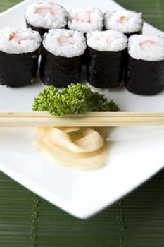 close up sushi on white plate