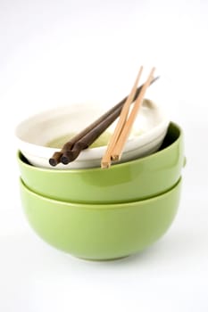 three stack of bowls with chopsticks on white background