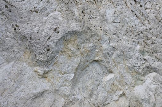 Steep mountain cliff rocky slope abstract stone background.