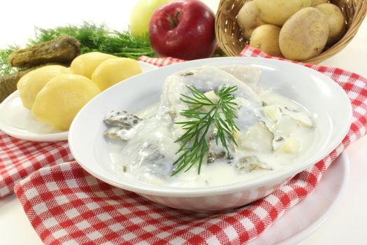 Cream herring with boiled potatoes and cucumber