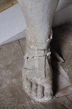 ATHENS - FEBRUARY 3: Broken plaster statue foot detail in the abandoned studio of sculptor Nikolaos Pavlopoulos, Athens Greece, February 3, 2012.