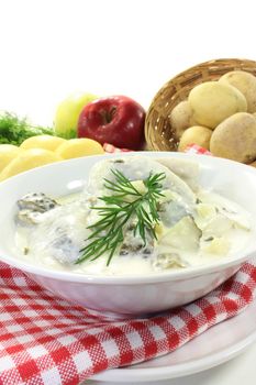 Cream herring with boiled potatoes and cucumber