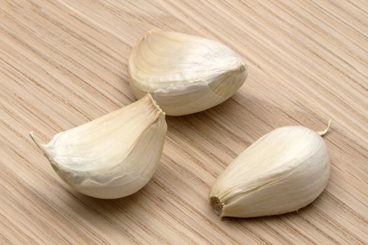 Garlic closeup on wood background 