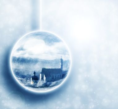 Winter scenery in christmas ball on snowy background