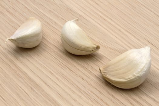 Garlic closeup on wood background 
