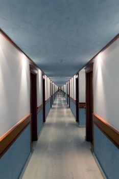 A long corridor has a lot of doors