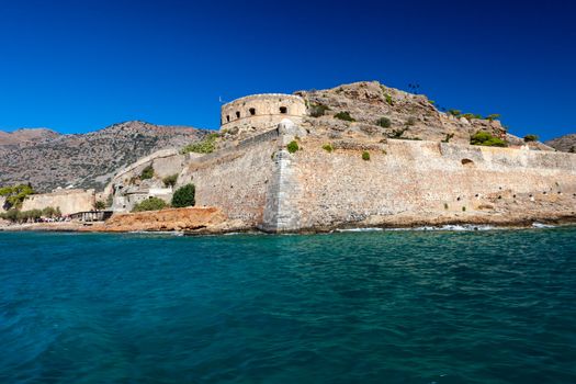 Spinalonga is a small island about Crete, located in the region of Lasithi in the Gulf of Mirabello, to the North of the villages of Plaka, Elounda