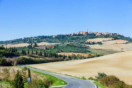 Typical beautiful Tuscan landscape-trees, grass, ski, villa. Italy