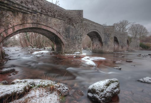 Old brick bridge in Wales at Christmas  