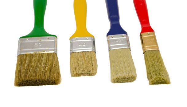 different colors and size paint brushes isolated on white background.