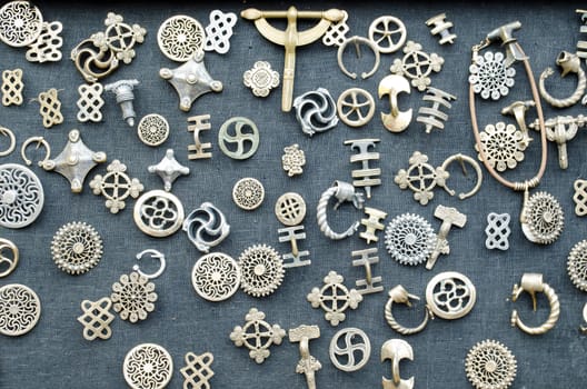 bronze brass accessories on black material background.