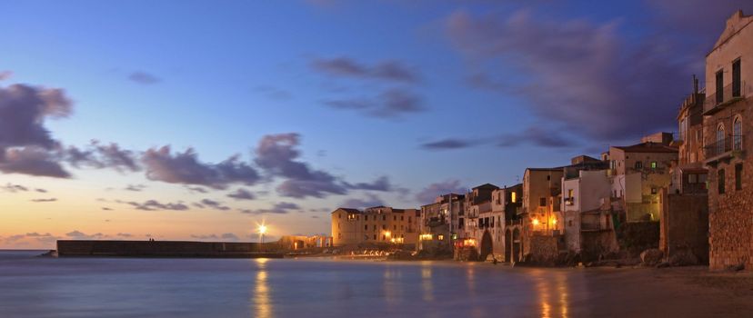 Chefalu  beach at sunset in sicily the largest of Italies islands