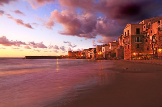 Chefalu  beach at sunset in sicily the largest of Italies islands