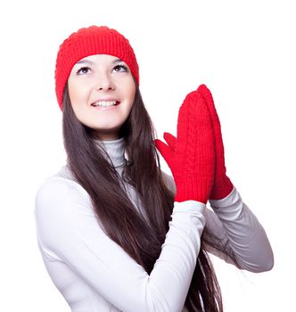a woman in a red cap and mittens rejoices..