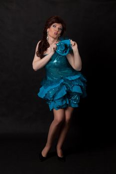 Full length portrait of drag queen. Man dressed as Woman, on black background