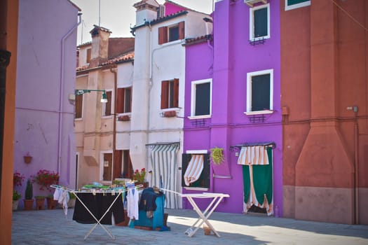 Drying laundry in front of the colorful buildings in Burano