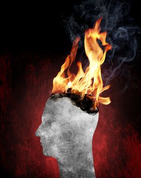 Conceptual image of a head burning in flames.