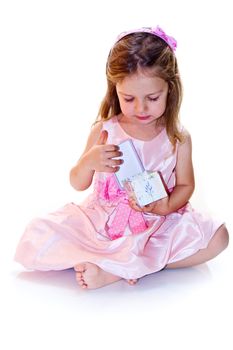 Joyful little girl holding lilac present in hands