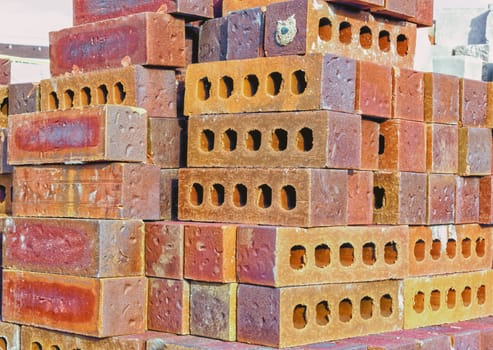 Bricks are Stacked in Rows, Ready to be Put to Work
