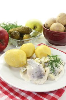 Cream herring with boiled potatoes and cucumber