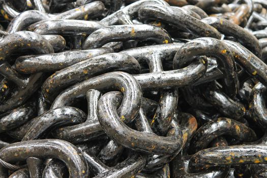 The new black anchor chain in stock shipyard